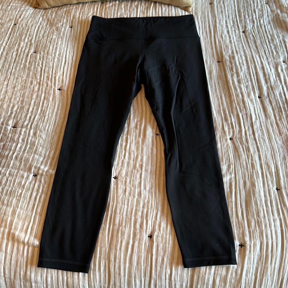 Athleta black leggings. Elation 7/8 tights. Never worn.
